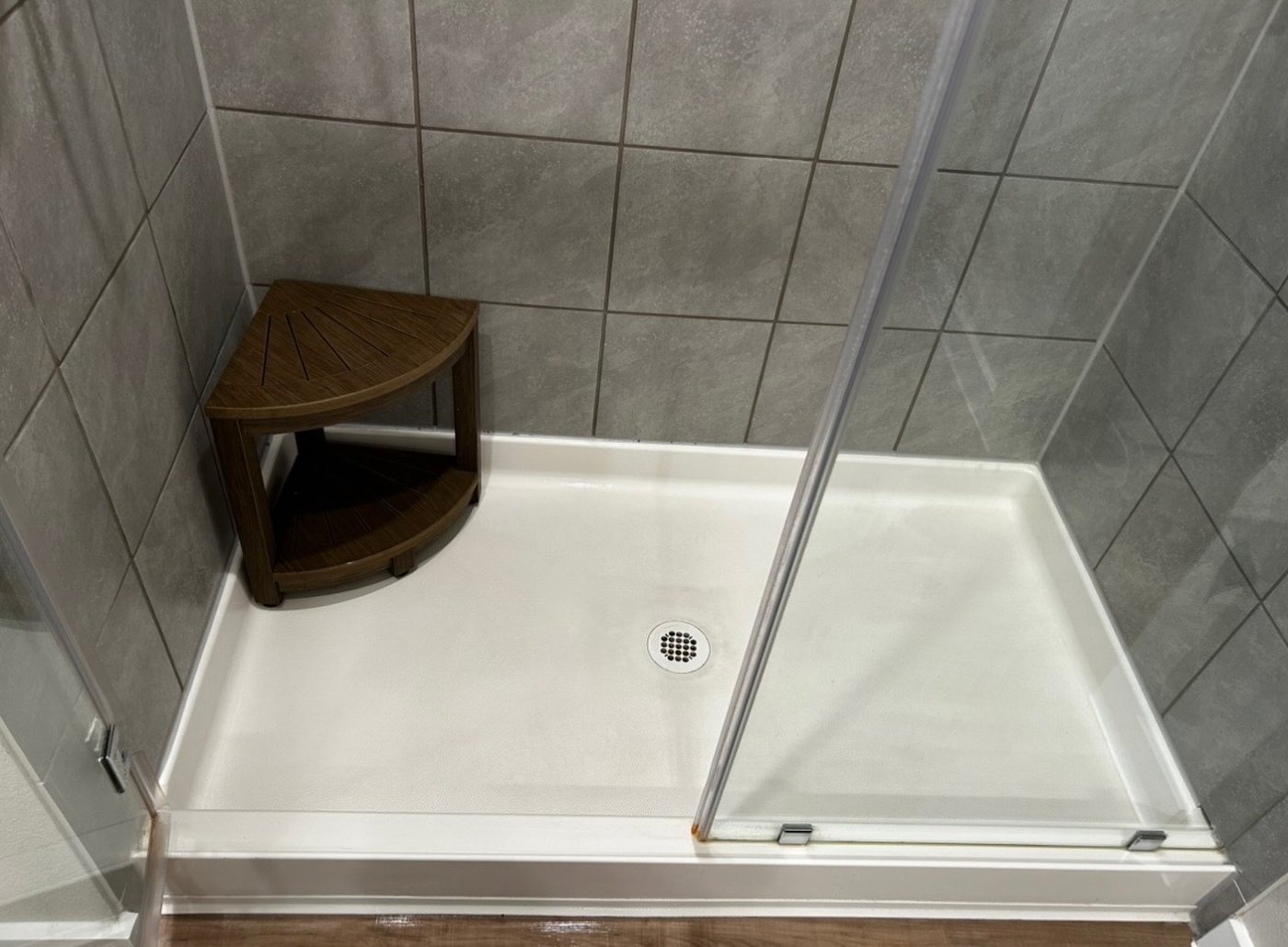 Shower pan after cleaning — clean and spotless